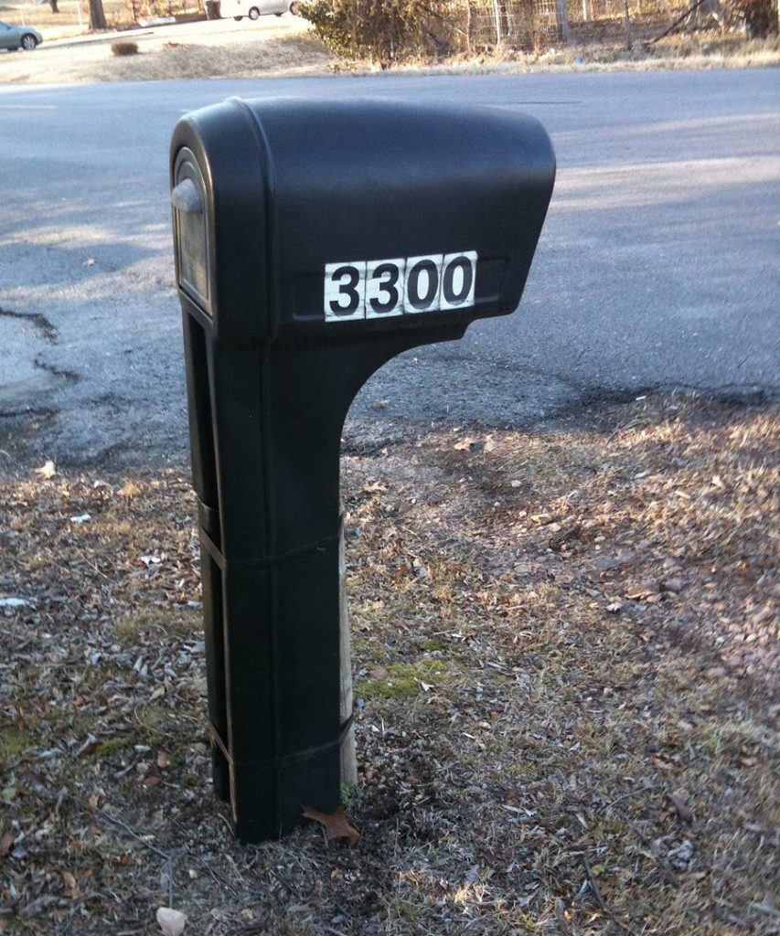 Plastic mailbox with ugly big box house numbers