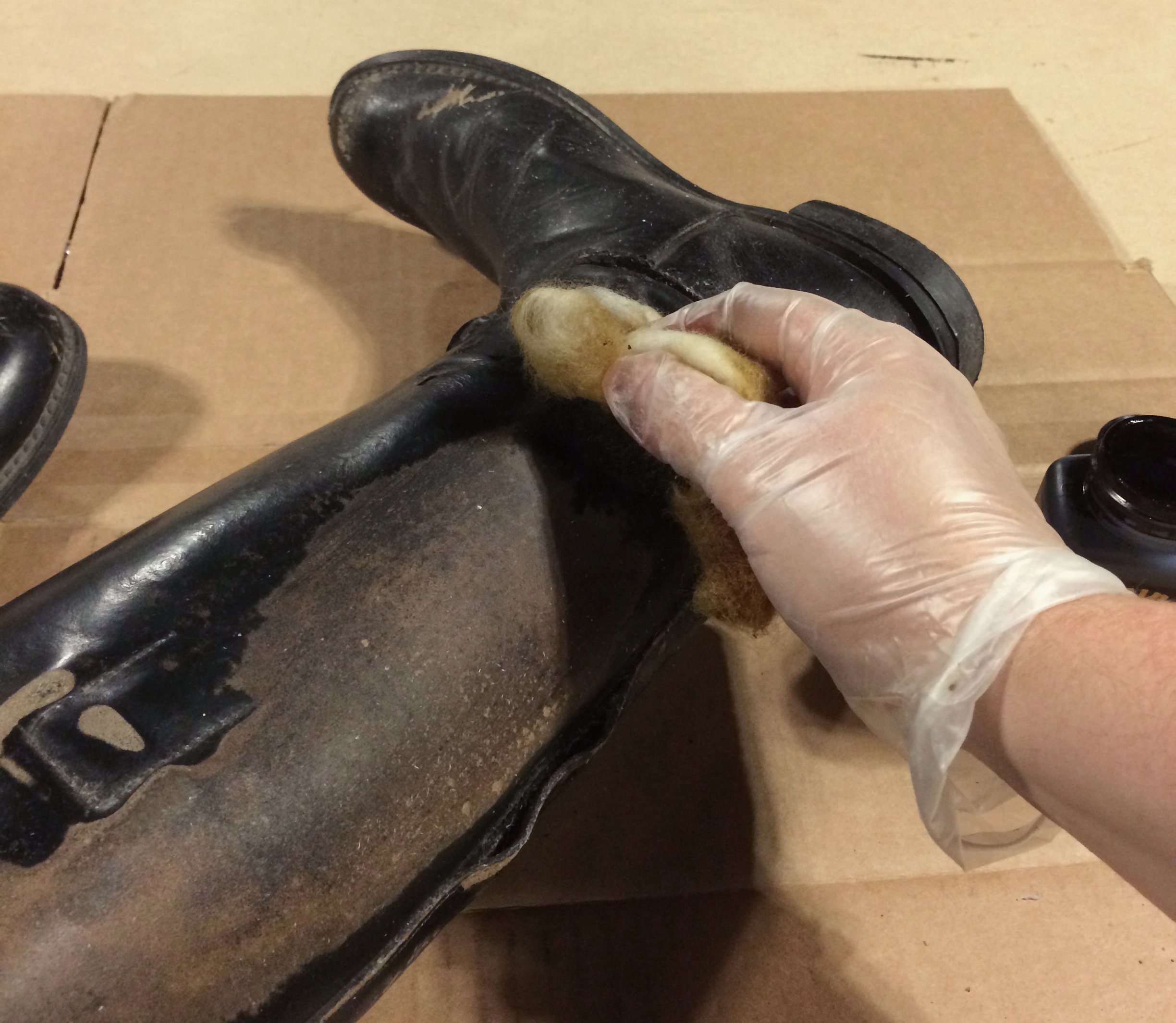 Restoring a worn boot using dye and a bit of wool roving.