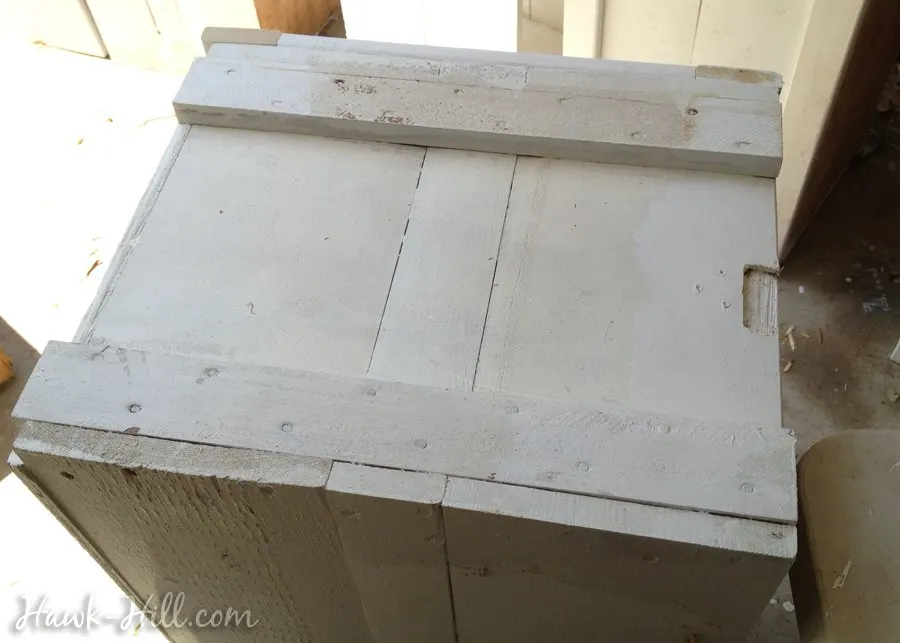 shipping crate being turned into a decorative planter
