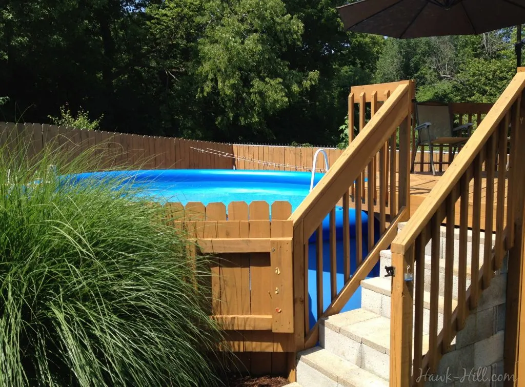 Safe and Stylish Landscaping and Deck for an Above Ground Pool