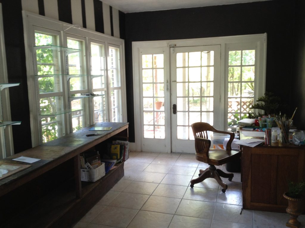 The "problem child" room in my house - a long, narrow room with 3 walls of windows- which the former owner painted black with white stripes! 