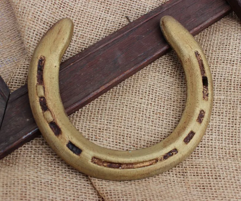 A quick coat of gold paint and antique finish can turn a free set of horse shoes into a $10-20 paycheck. 