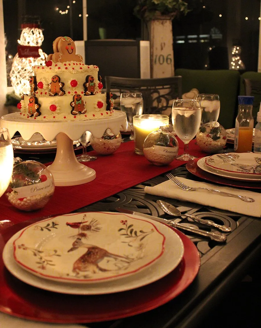 holiday table setting with christmas cake and rustic decor
