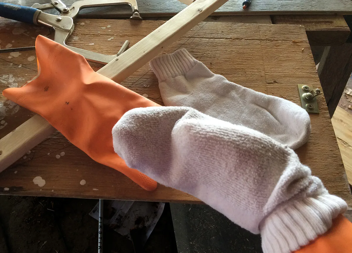 Pair a rubber glove and an inside-out-sock for a super-fast way to paint poles, posts, spindles, and thin planks. 