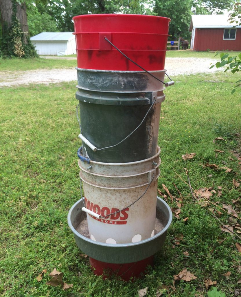This easy DIY chicken feeder costs about $10 to make and holds 40lbs of feed. - Hawk-Hill.com