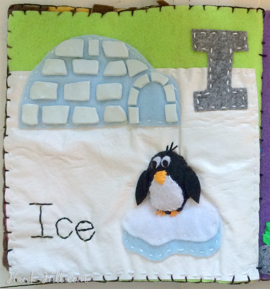My quiet book's "I" page features a penguin and a igloo made from polymer clay "ice".