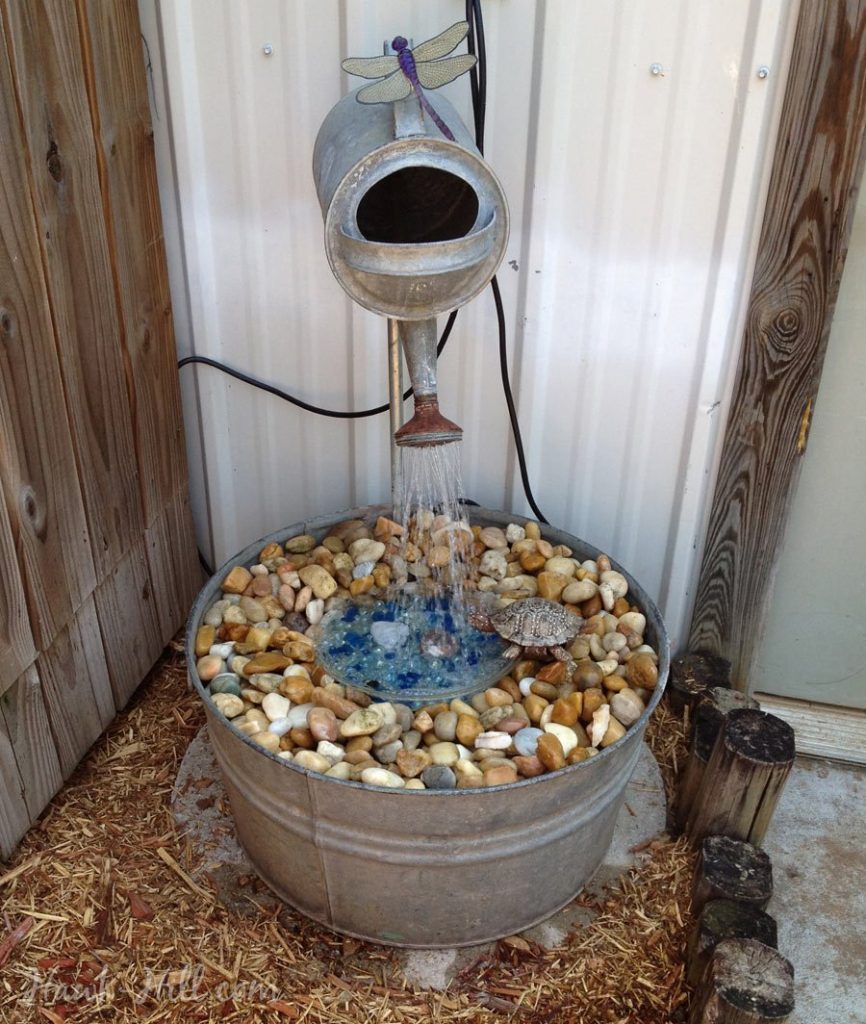 galvanized watering can fountain