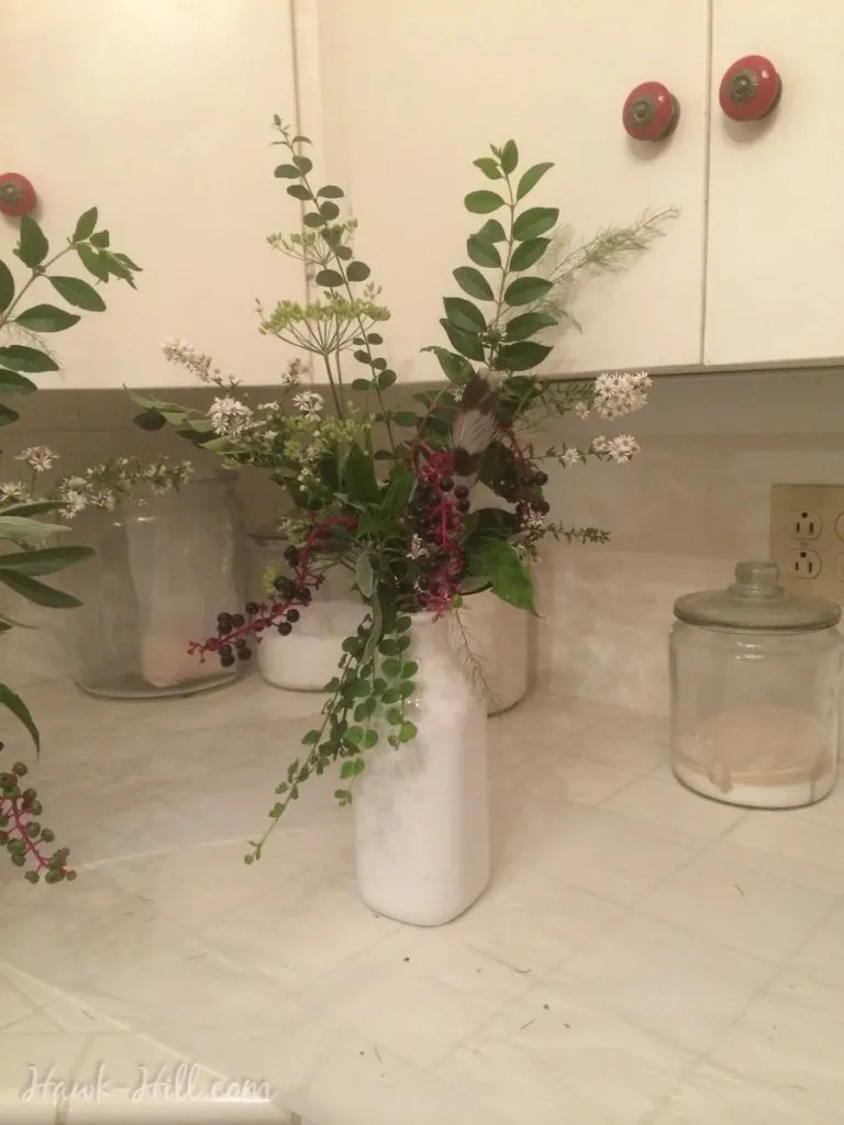 Flower arrangements made with weeds, greens, and landscape clippings