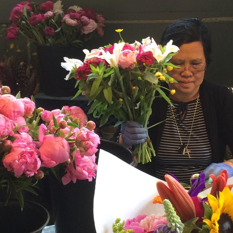 Woman Making a boquet at Pike Place Market