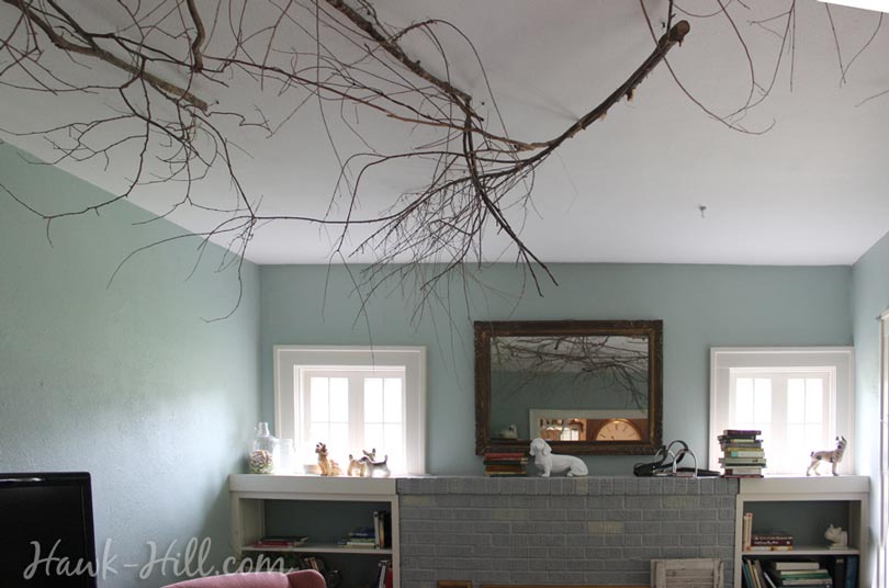 putting branches on the ceiling for whimsical decor