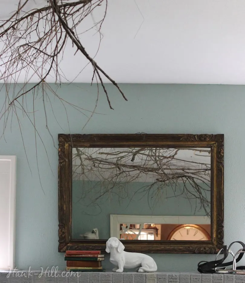 putting branches on the ceiling for whimsical decor