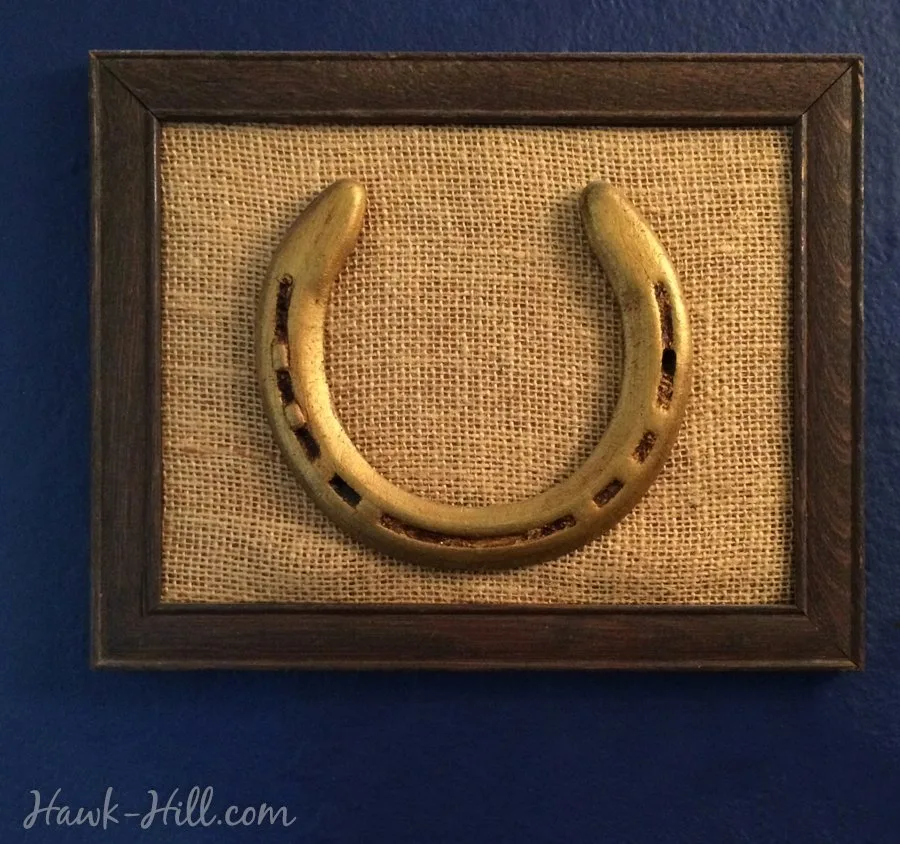framed gold equestrian horse shoe