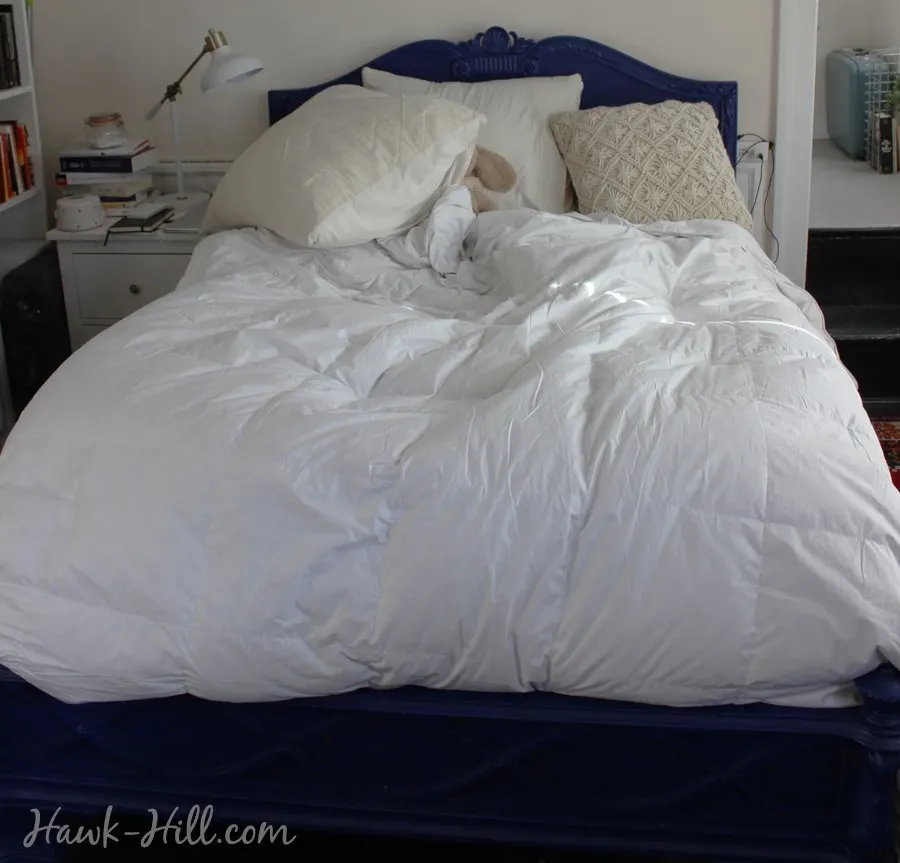 blue bed with down comforter