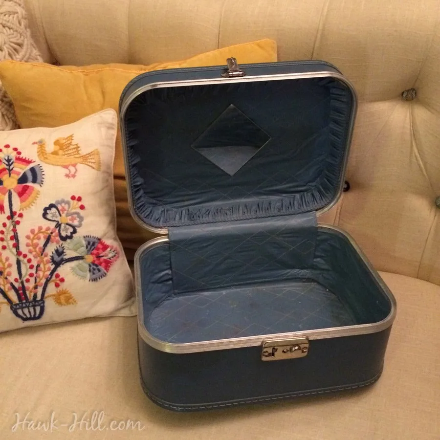 A blue vintage cosmetic case 