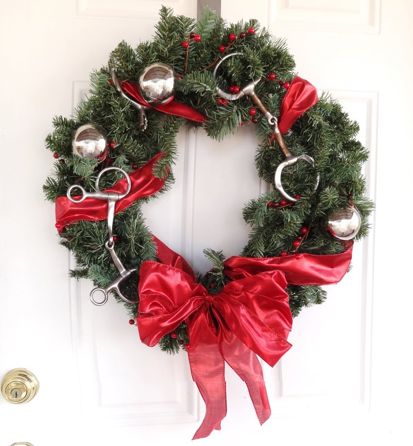 christmas wreath with bit and spurs added for stable or barn decorations