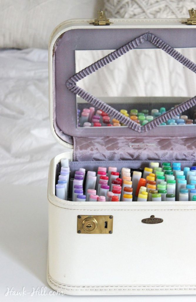 Using a vintage train case for art supply marker storage