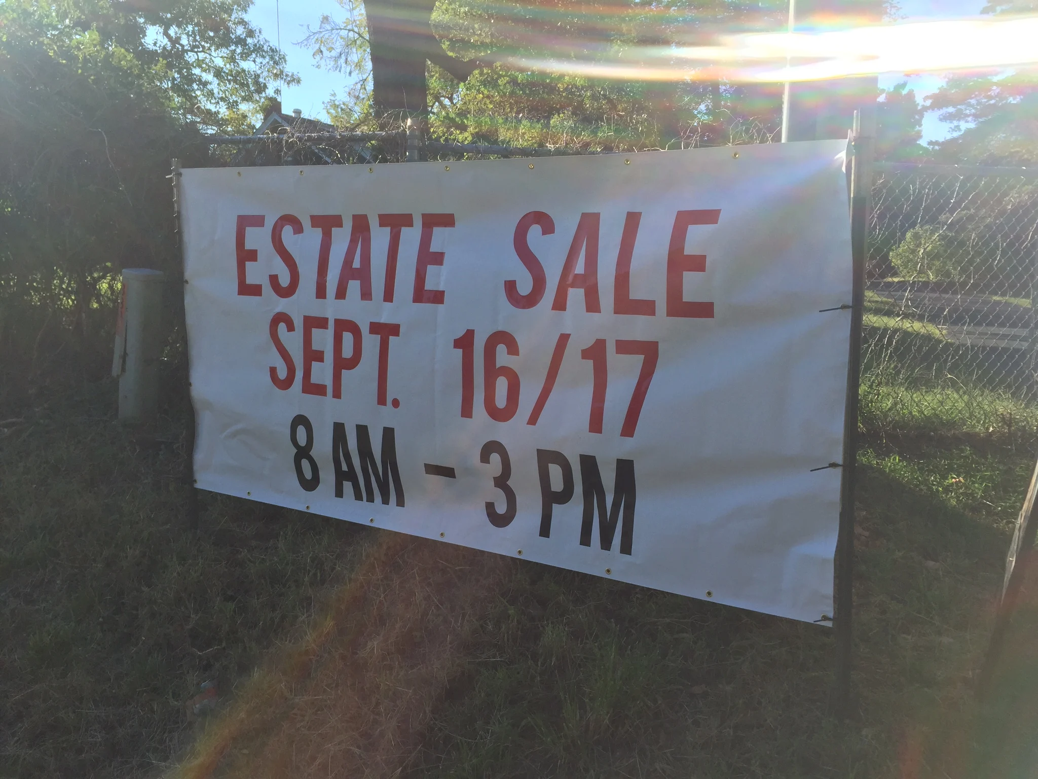 A sign advertising an estate sale