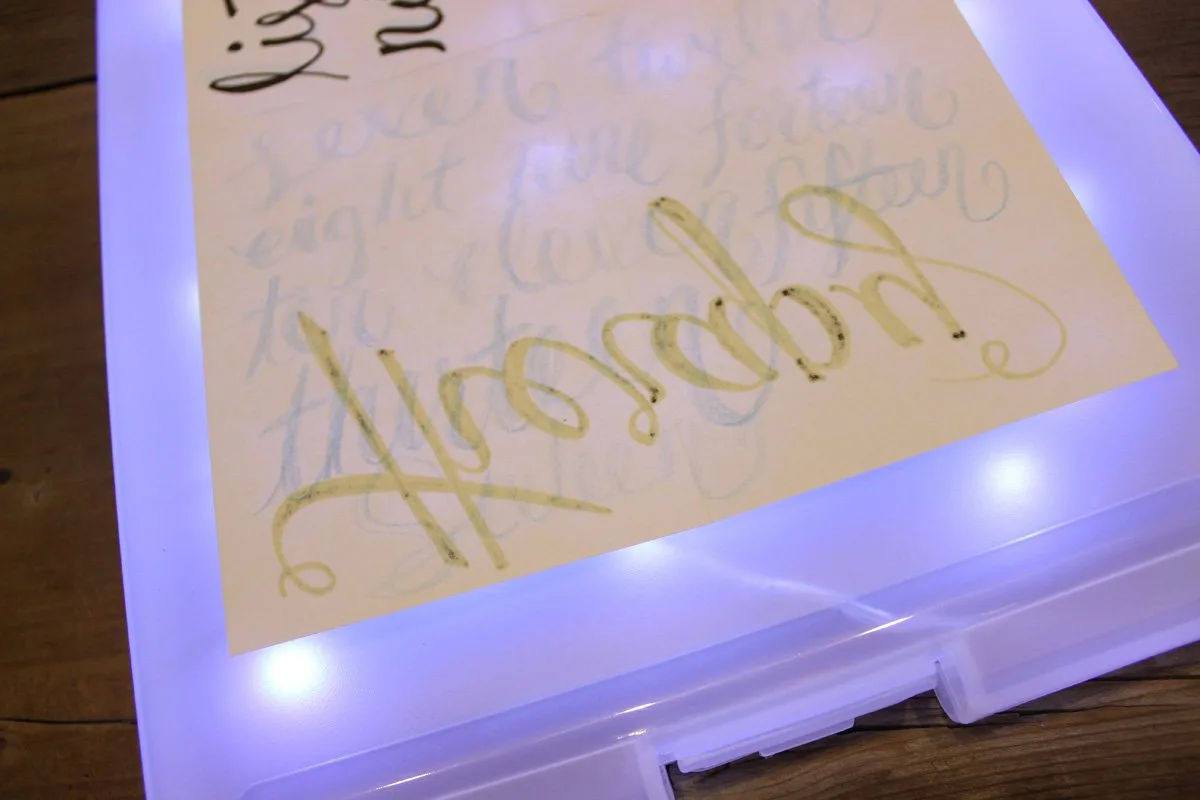 A portable light box for tracing makes practicing hand lettering much easier