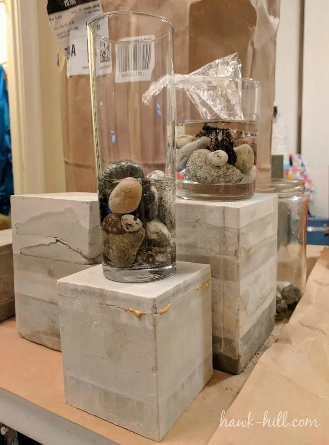 This photo shows a midpoint in my project. Vessels with sealed stones have a layer of resin poured and cured, then dimensional pieces of resin are added and secured in place with a second flat-pour of resin. 