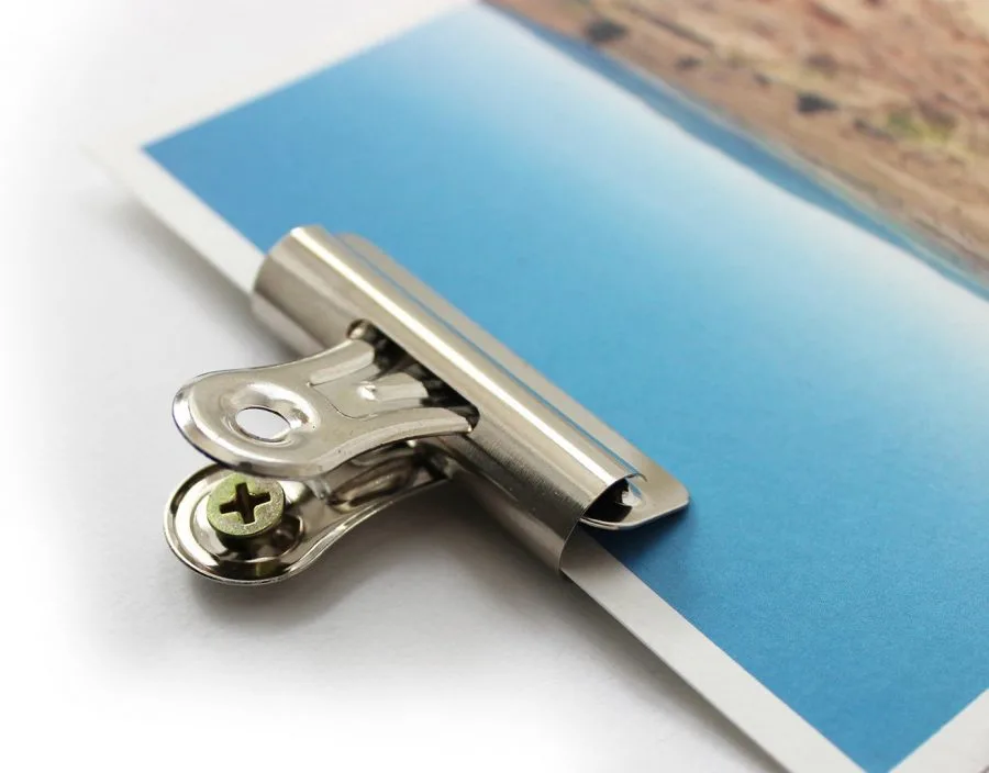 use bulldog clips to mount and hang items that are difficult to hang