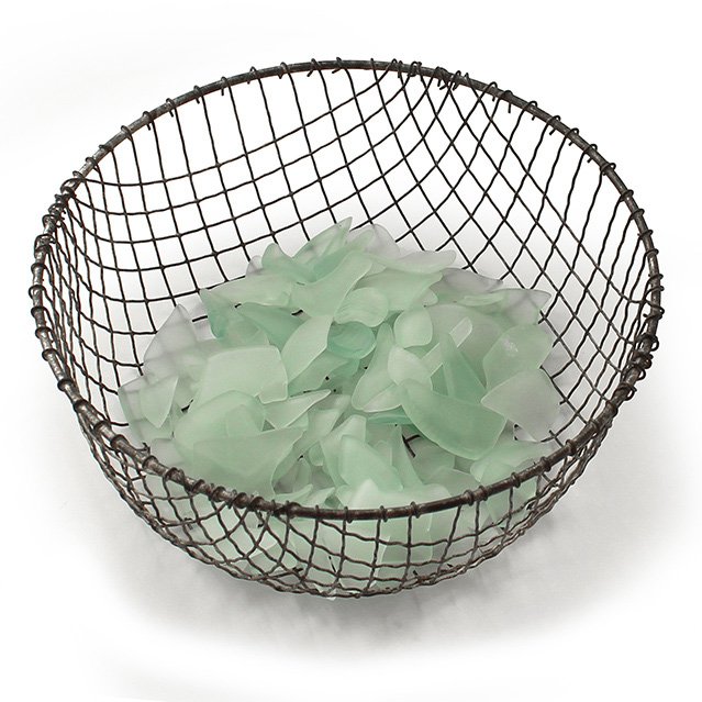 The final step of making your own sea glass is dumping the sludge from the barrel into a colander with large holes and rinsing until only the clean, large pieces of sea glass remain in the colander.