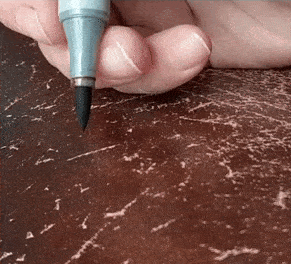 You can use Copic markers to repair scratches in leather