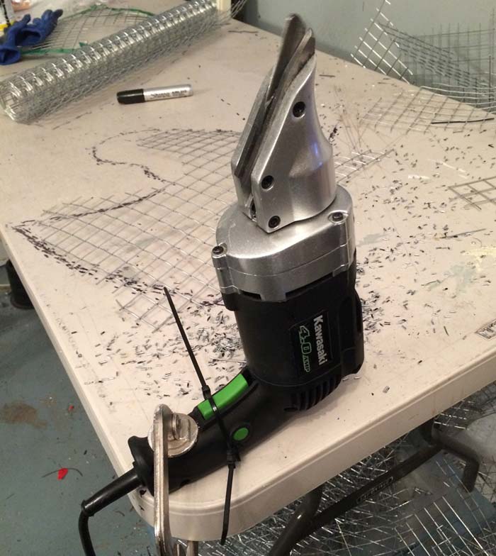 Electric snips mounted on a table
