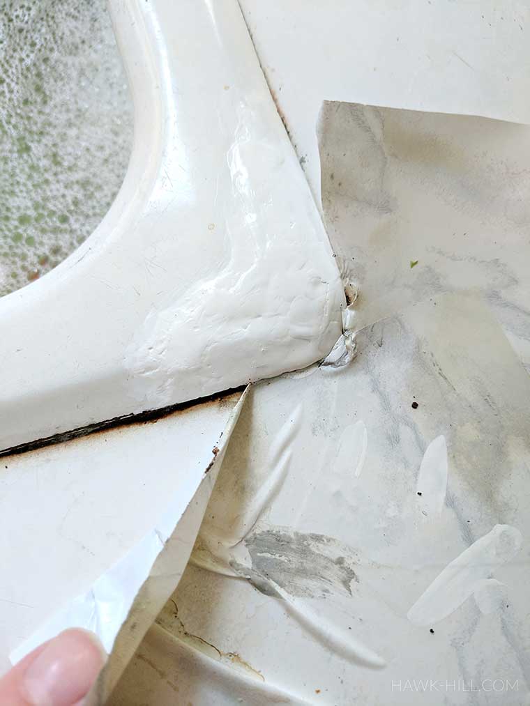 carefully apply paint to the tub or sink, over the patched portion