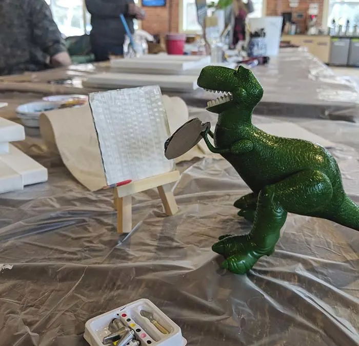 Dino-artist sets the stage for a playful not-too-serious night of painting.