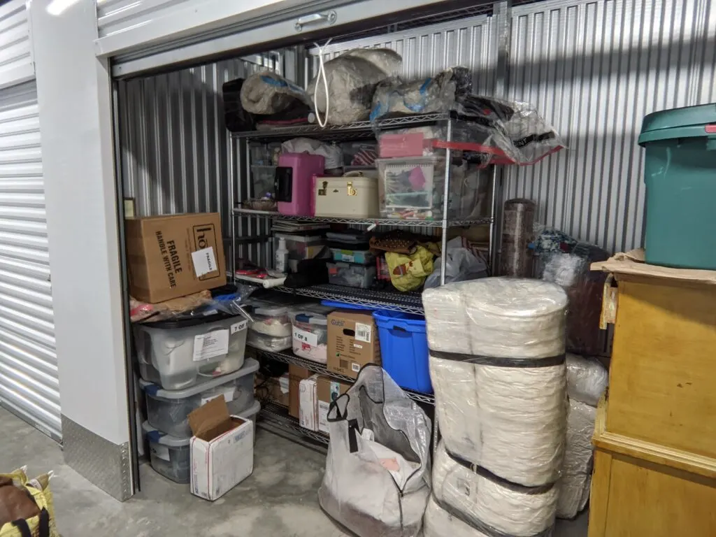 A rented storage unit filled with personal belongings.