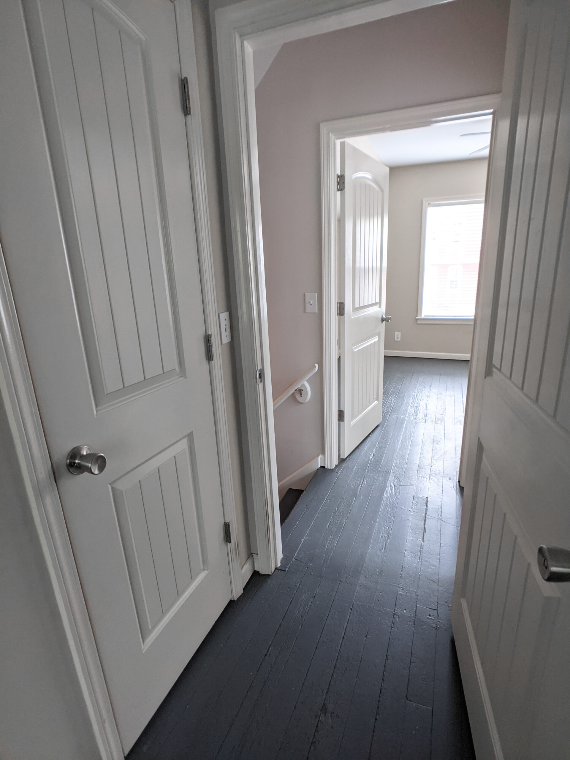 A landing looking into a second bedroom.