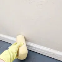 closeup of a beige wall being washed.