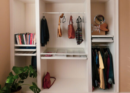 An IKEA wardrobe with bead board wallpaper attached.