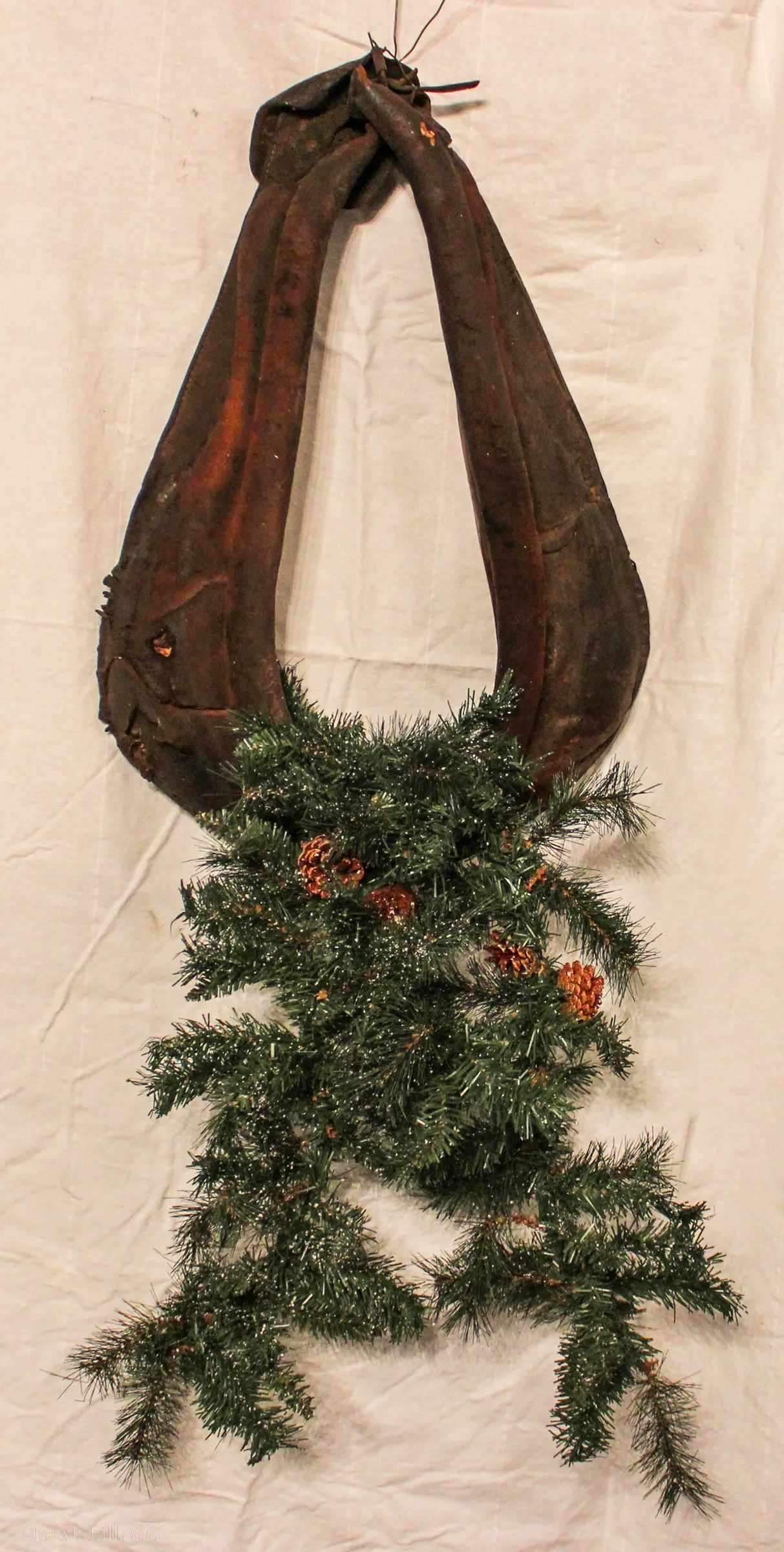 Harness with christmas garland attached.