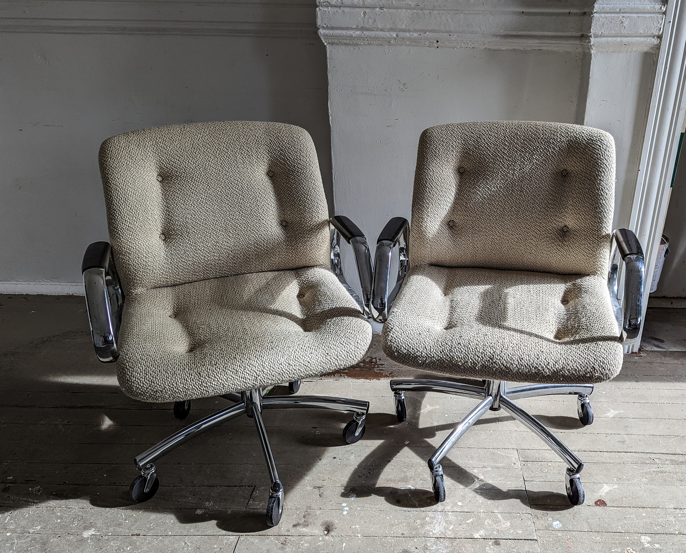 Two midcentury modern office chairs