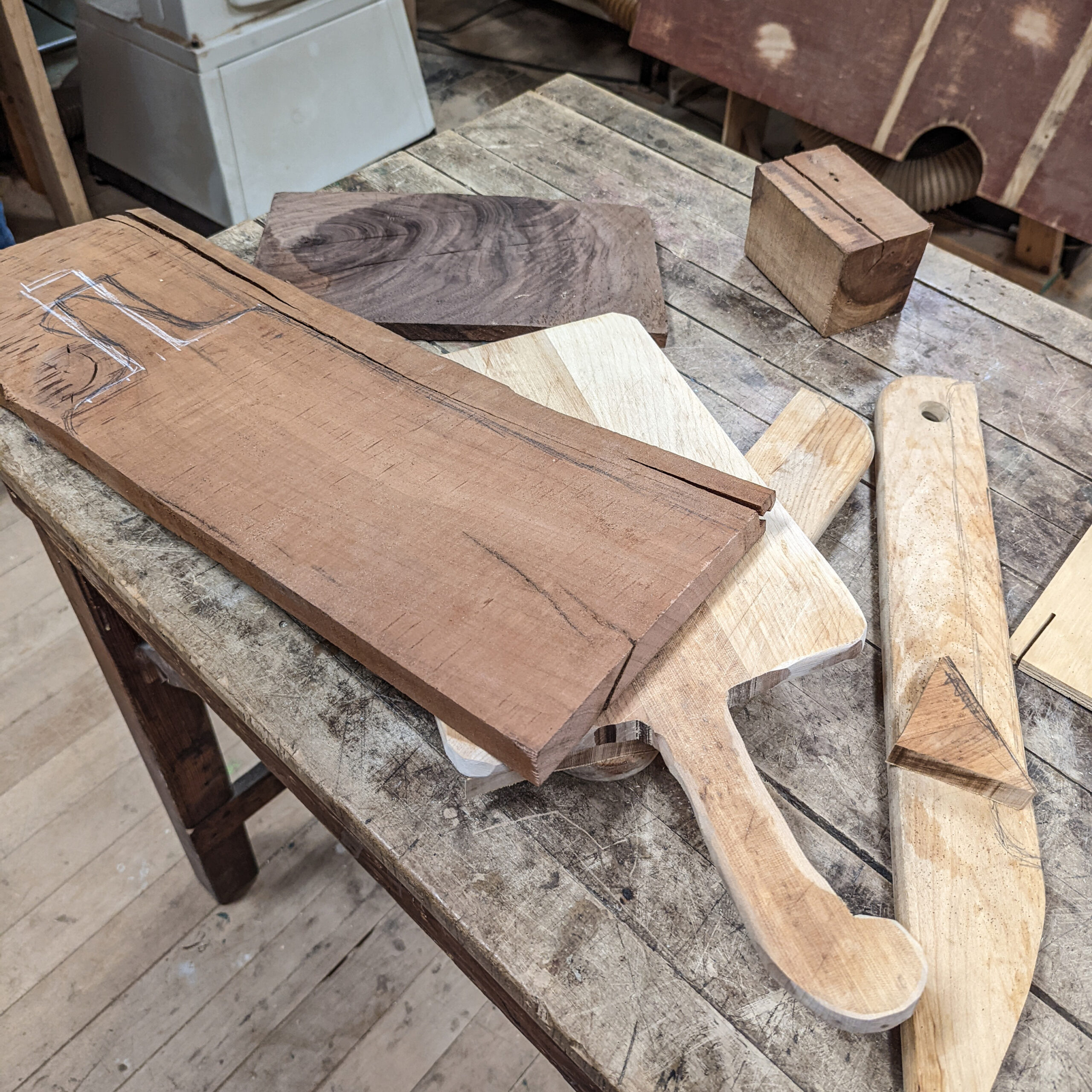 DIY decorative cutting boards in production in a community woodshop.