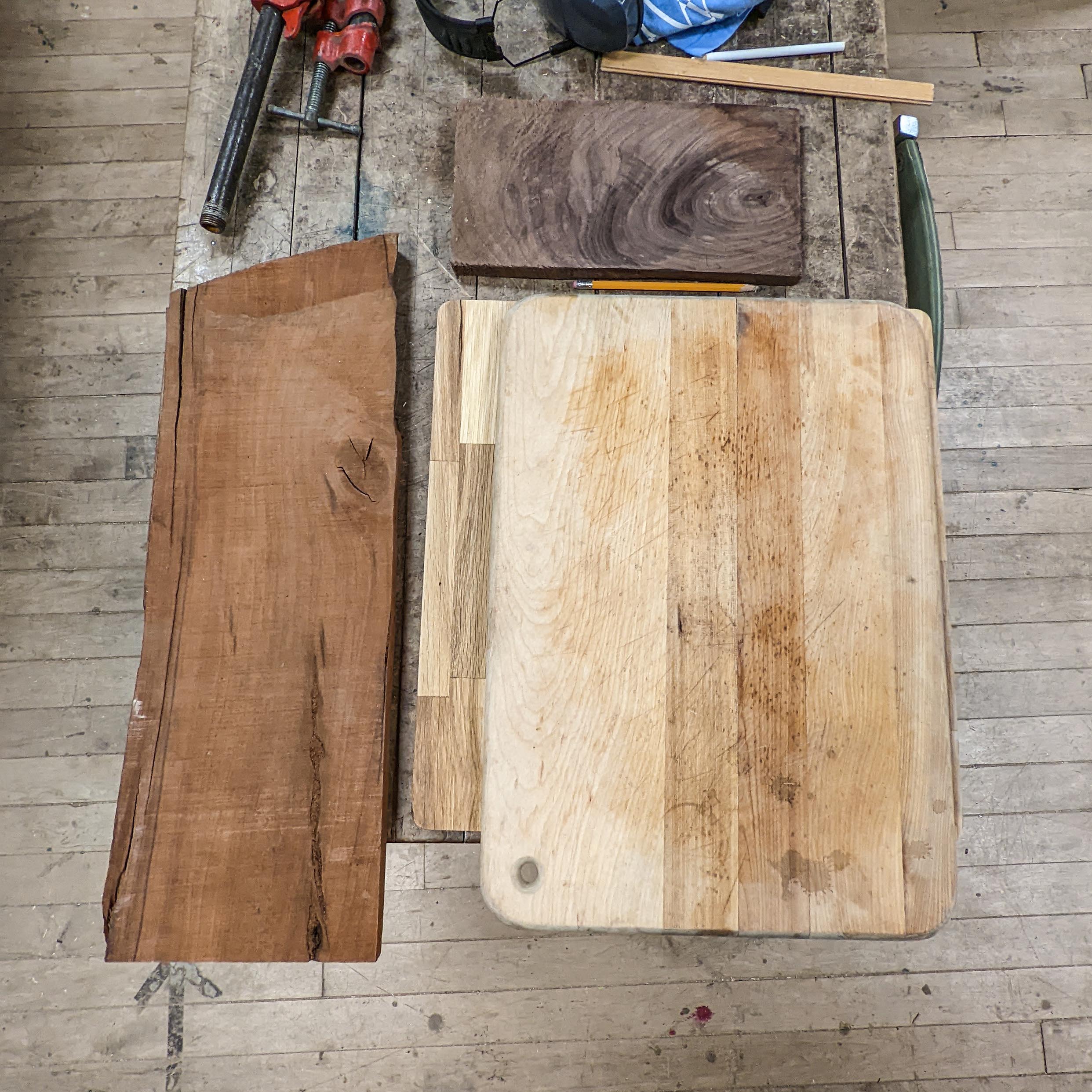 Raw wood planks and a ugly dated cutting board.