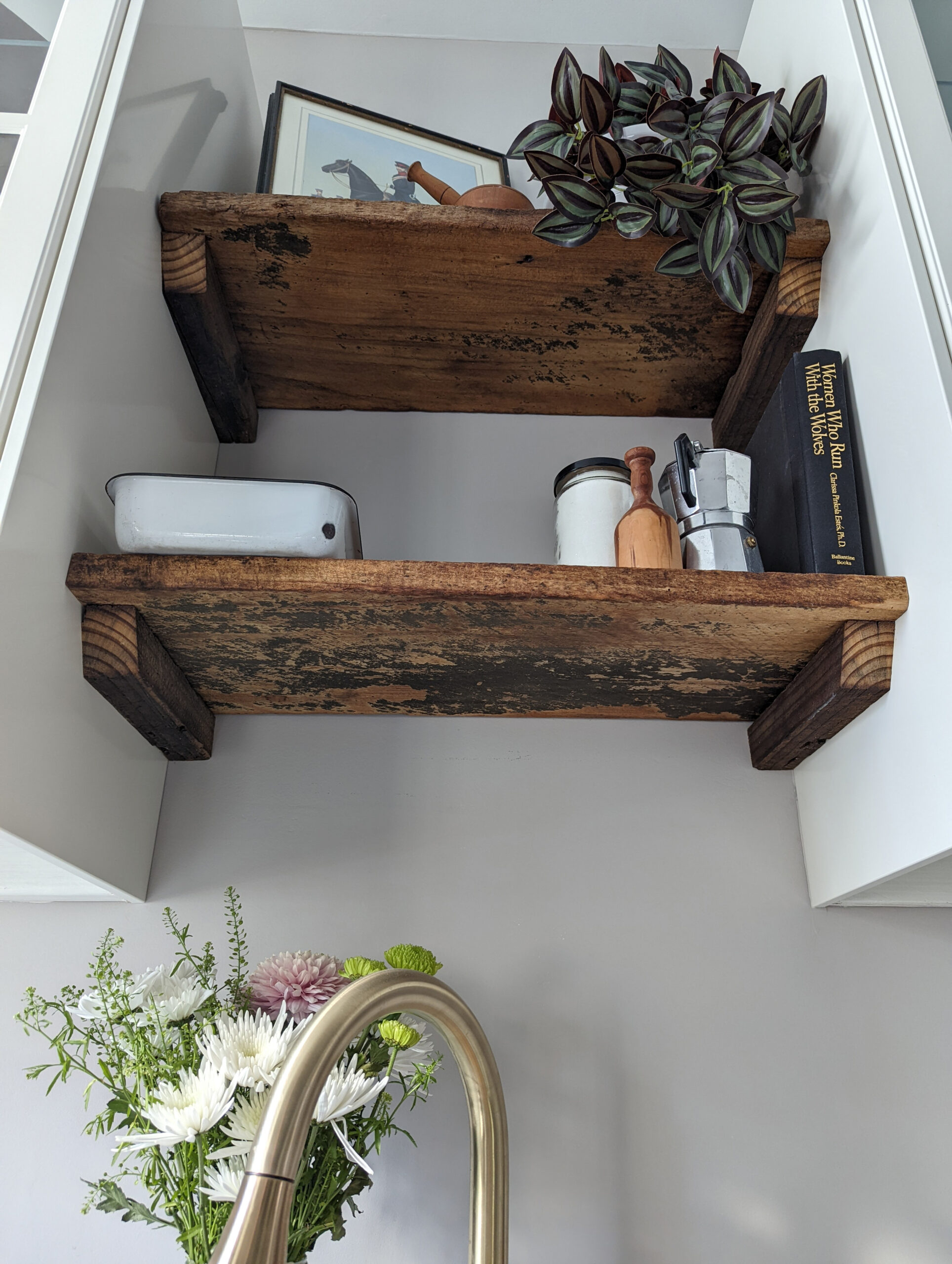 Reclaimed distressed lumber shelving, shown from below.