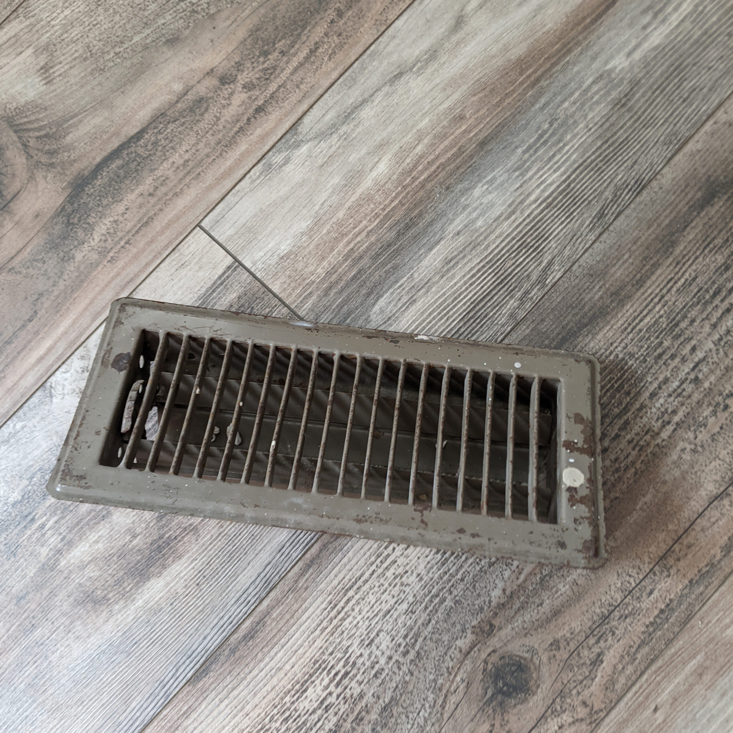 rusted heater vent grille in my home.