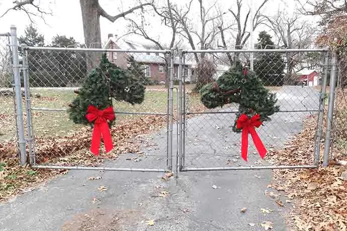 horse wreaths on hawk hill's front gates
