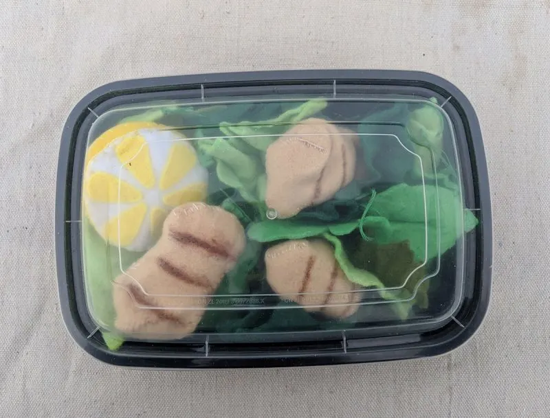 packaging felt food in meal prep containers is an easy way to package your food and helps keep play kitchens tidy.
