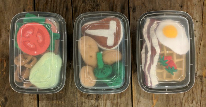 storing felt fruits and vegetables in a takeout container keeps things clean and organized